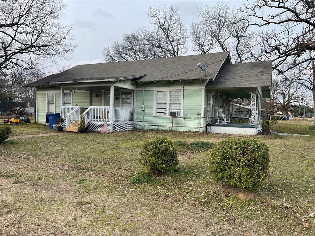 1023 North Spring Street Grand Saline, TX 75140 - Photo 26 of 39 a front view of a house with garden