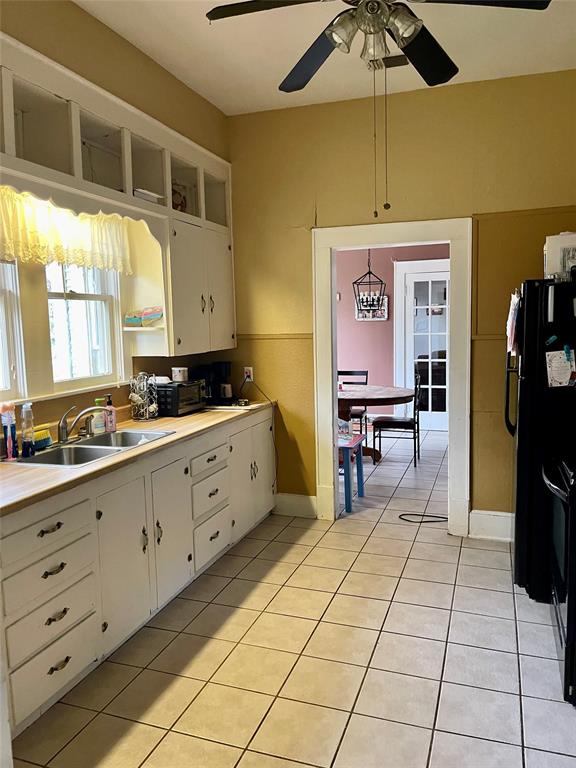 1023 North Spring Street Grand Saline, TX 75140 - Photo 31 of 39 a kitchen with cabinets and window