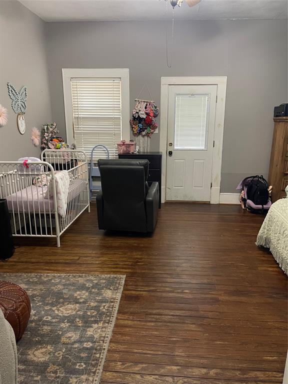 1023 North Spring Street Grand Saline, TX 75140 - Photo 9 of 39 a bedroom with furniture and a window