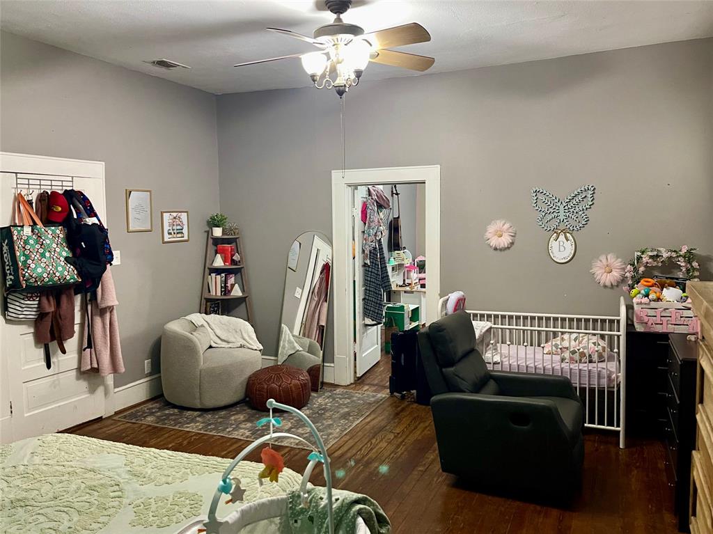 1023 North Spring Street Grand Saline, TX 75140 - Photo 10 of 39 a living room with furniture flowerpot and wooden floor