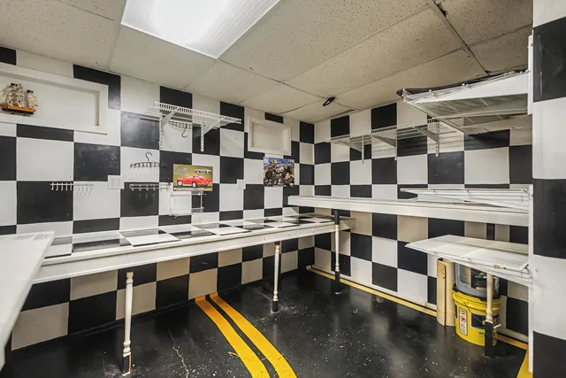 a kitchen with a sink and cabinets