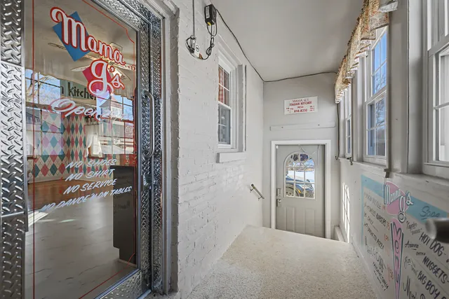 a picture of a park with a bench and a lamp