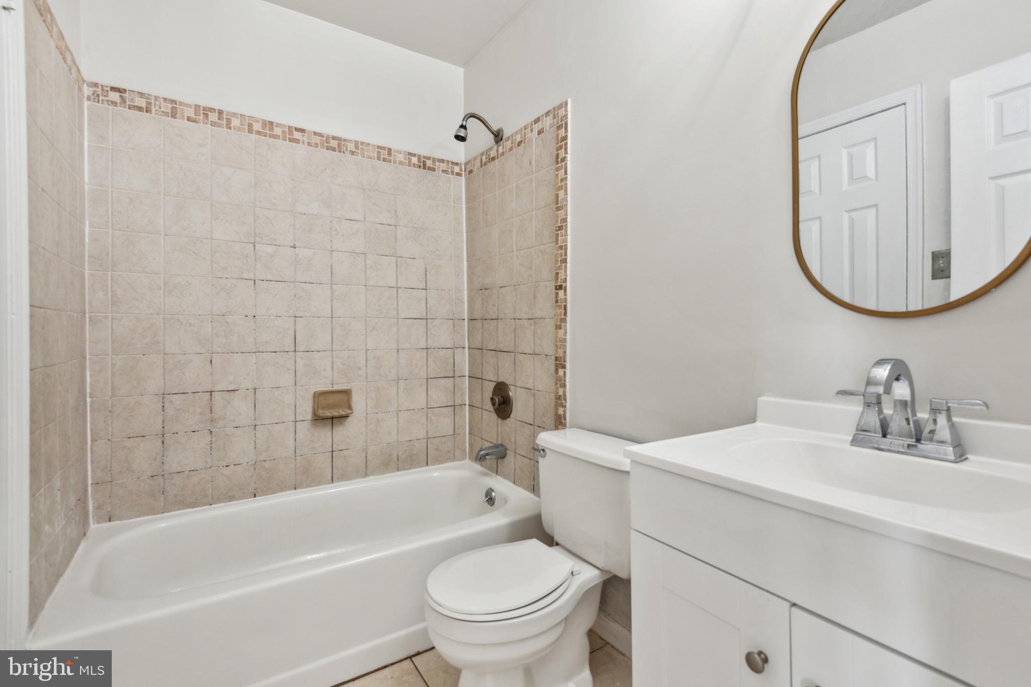 795 St Michaels Drive Bowie, MD 20721 - Photo 12 of 25 a bathroom with a sink a toilet and a bathtub