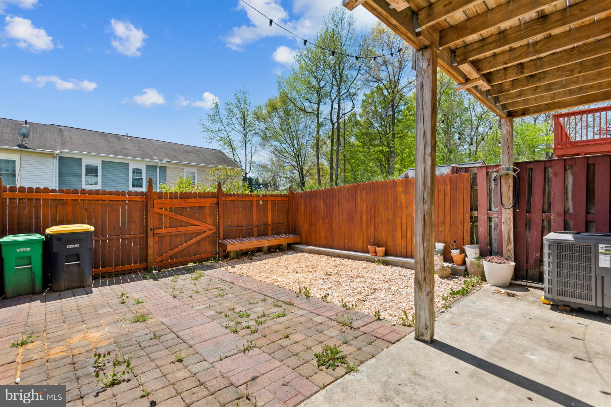 795 St Michaels Drive Bowie, MD 20721 - Photo 19 of 25 a backyard of a house with a tree