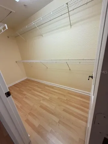 a view of a room with racks on the wall