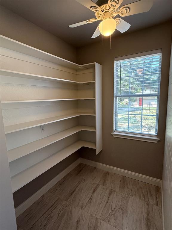 474 Needham Road Pottsboro, TX 75076 - Photo 14 of 40 a view of a room with a ceiling fan and a window