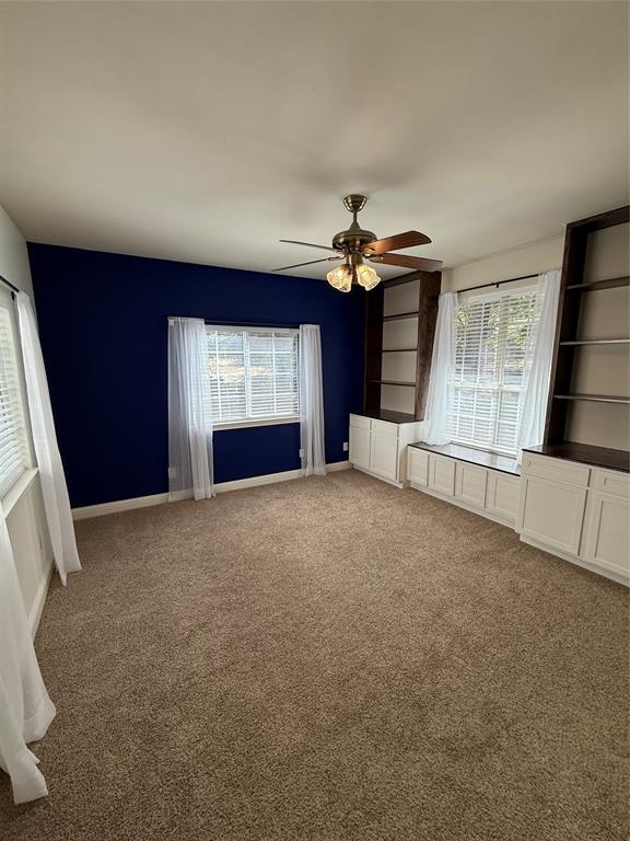 474 Needham Road Pottsboro, TX 75076 - Photo 19 of 40 a view of an empty room with a fireplace and a window