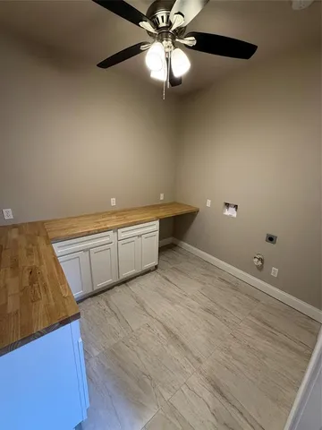 a room with washing machine and sink