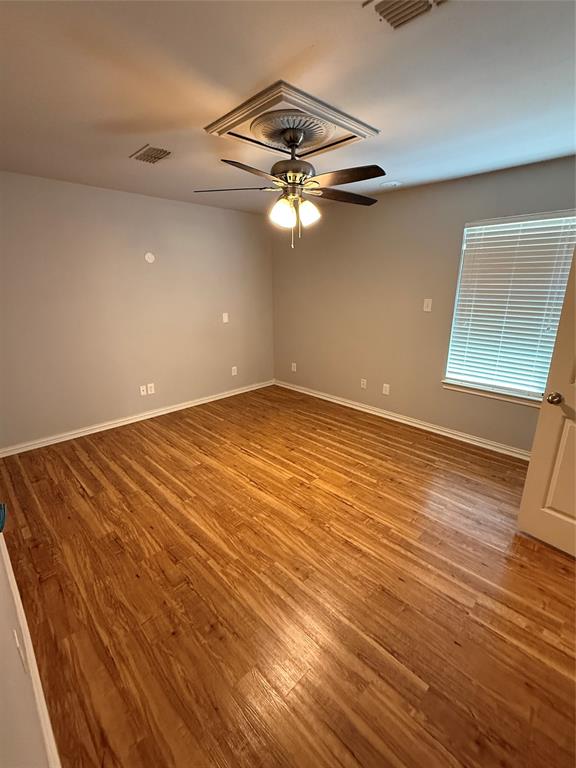 474 Needham Road Pottsboro, TX 75076 - Photo 31 of 40 a view of a room with wooden floor fan and window