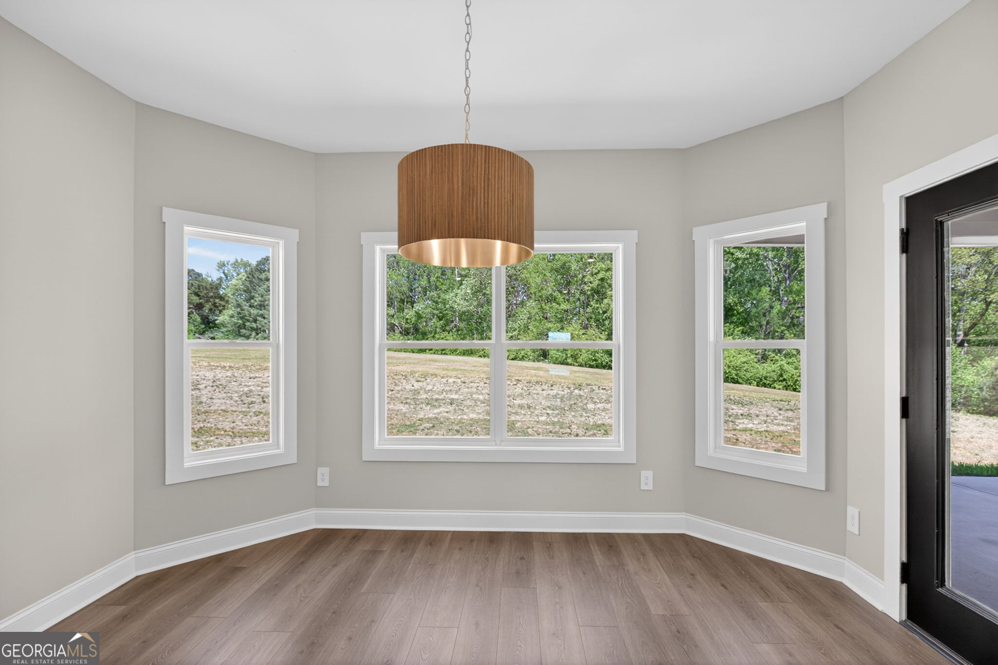 14539 County Road 10 Ranburne, AL 36273 - Photo 21 of 54 a view of an empty room with wooden floor and a window