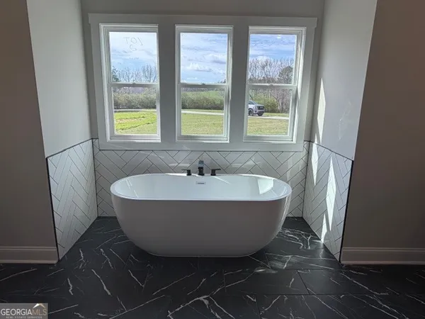 a bathroom with a shower and a sink