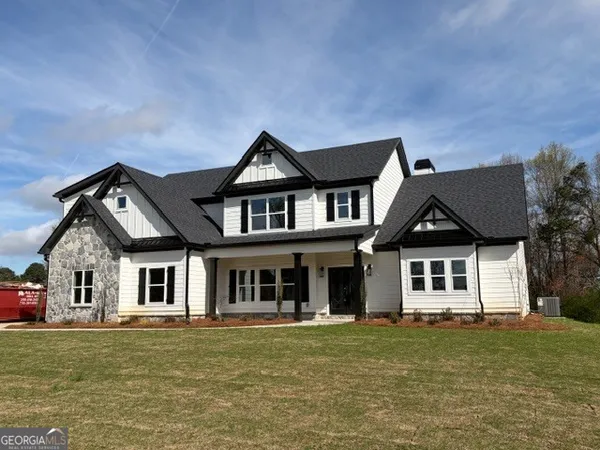 front view of a house with a garden