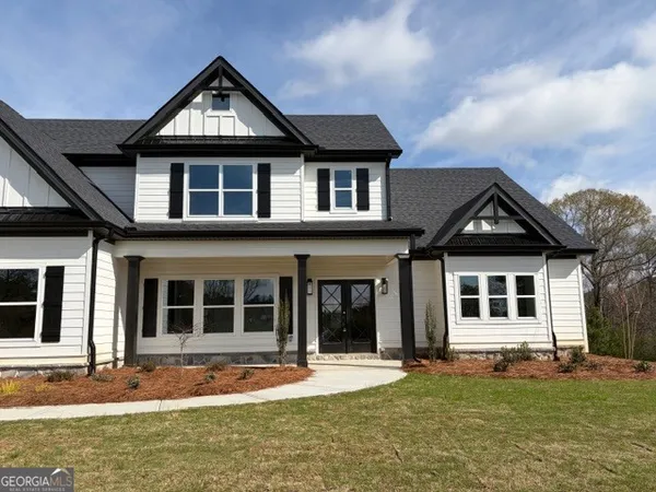 a front view of a house with a yard