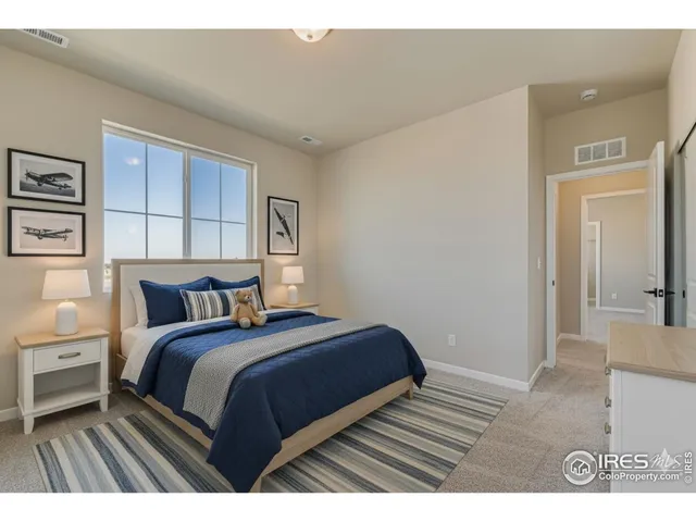 a bedroom with a bed and a cabinets