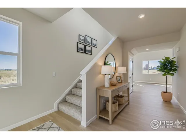 a view of entryway livingroom and hall