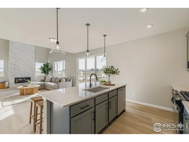 a kitchen with sink and cabinets