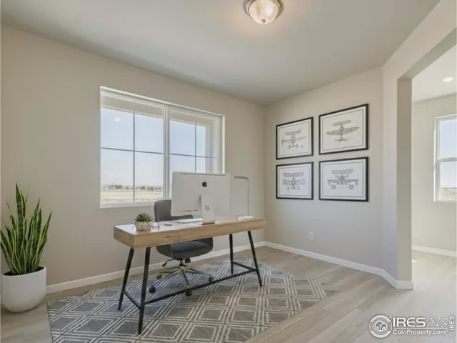 a workspace with furniture and window