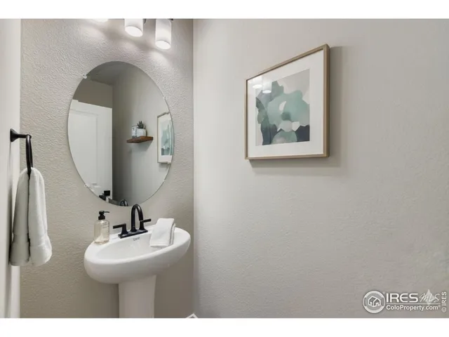 a bathroom with a sink and mirror
