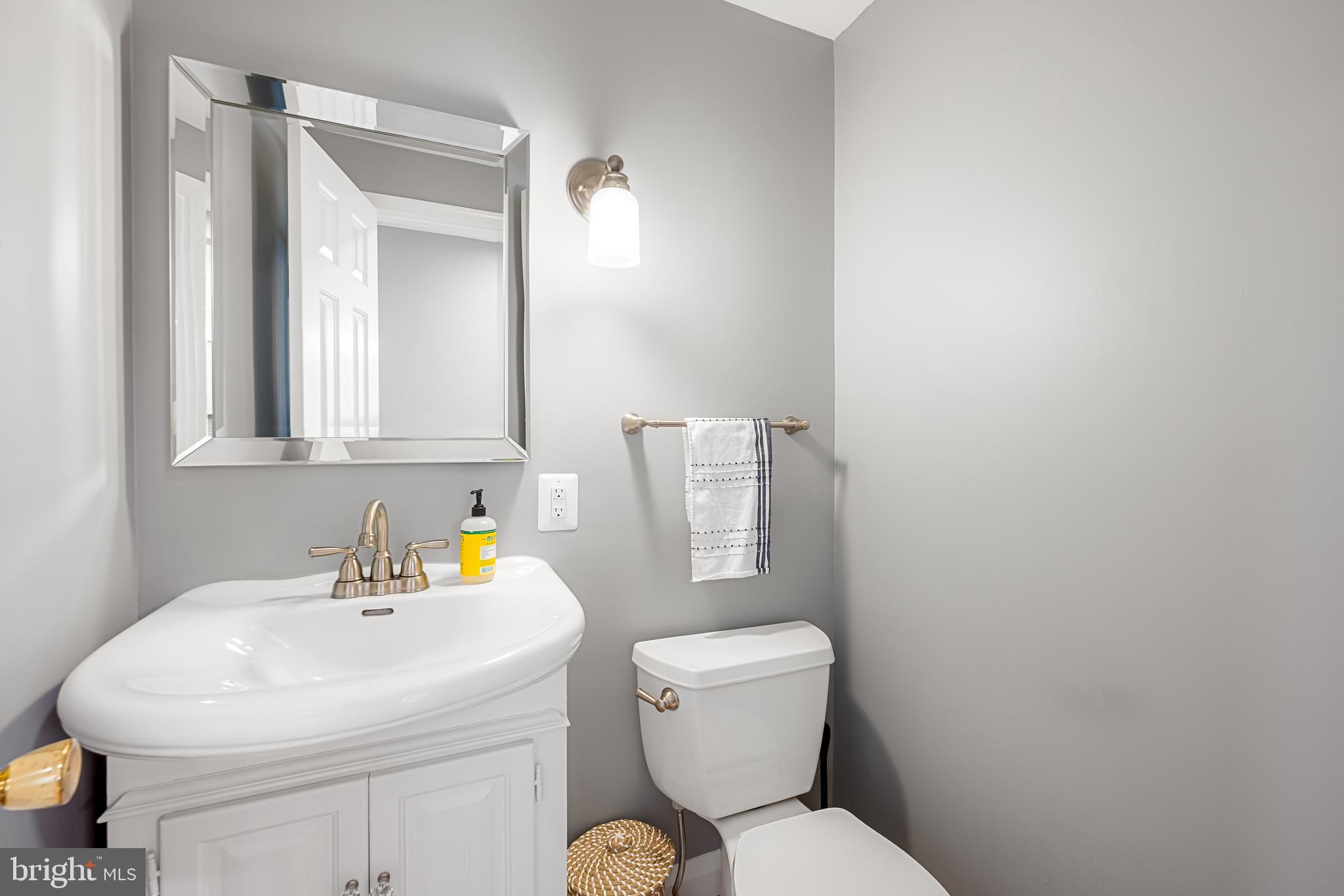 515 Yarmouth Road Baltimore, MD 21286 - Photo 16 of 44 a bathroom with a sink toilet and a mirror