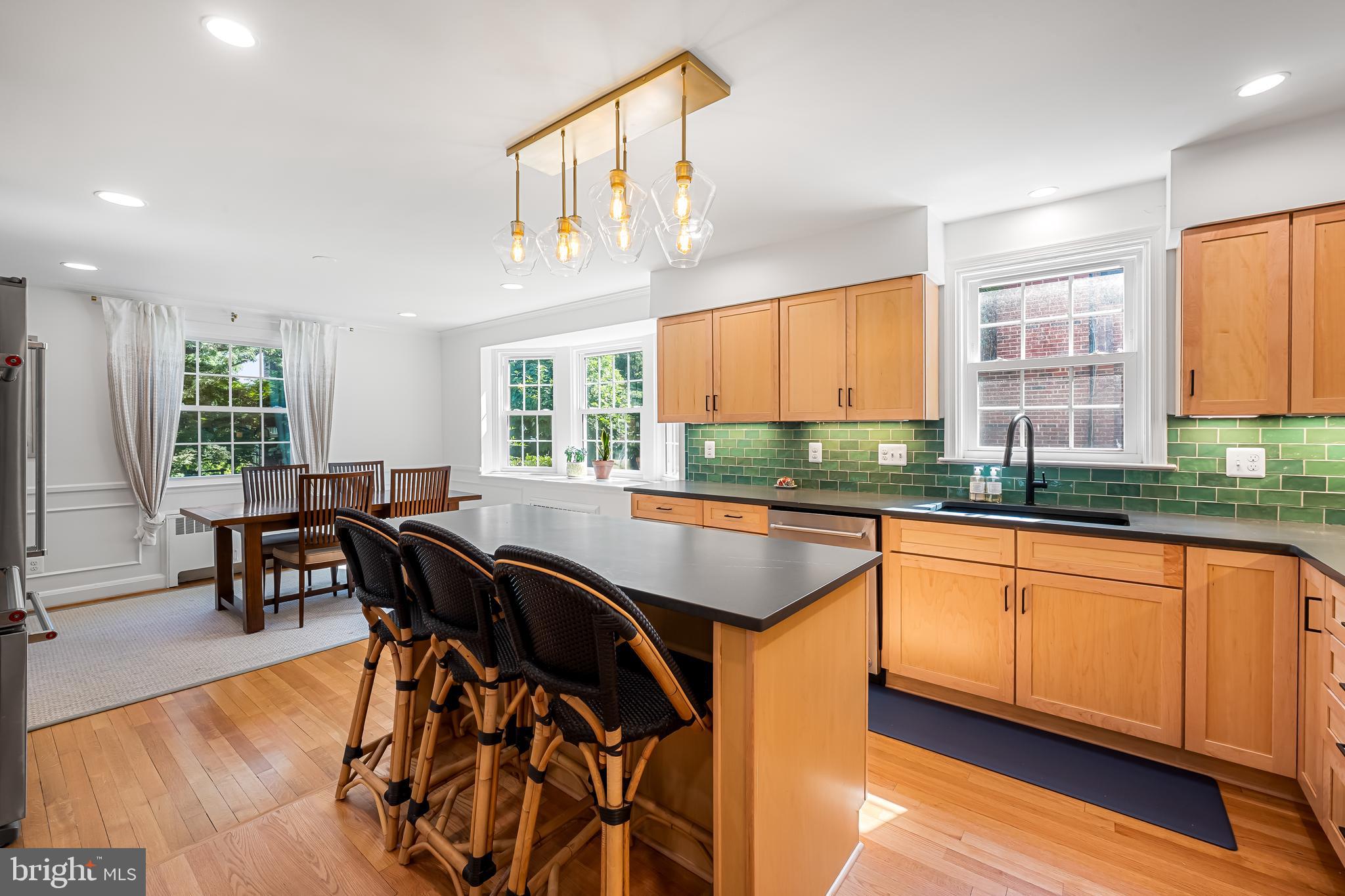 515 Yarmouth Road Baltimore, MD 21286 - Photo 2 of 44 a kitchen with stainless steel appliances granite countertop table chairs sink and cabinets