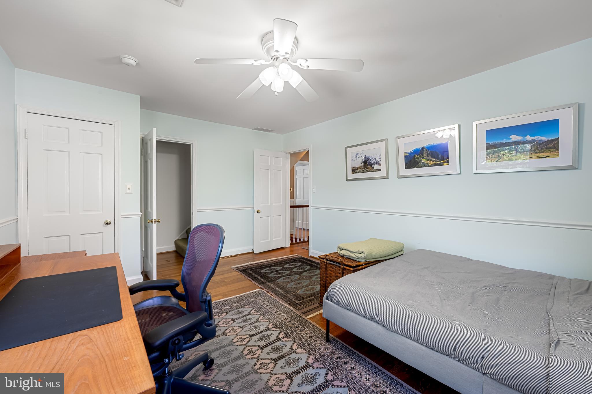 515 Yarmouth Road Baltimore, MD 21286 - Photo 24 of 44 a bedroom with a bed and a chandelier