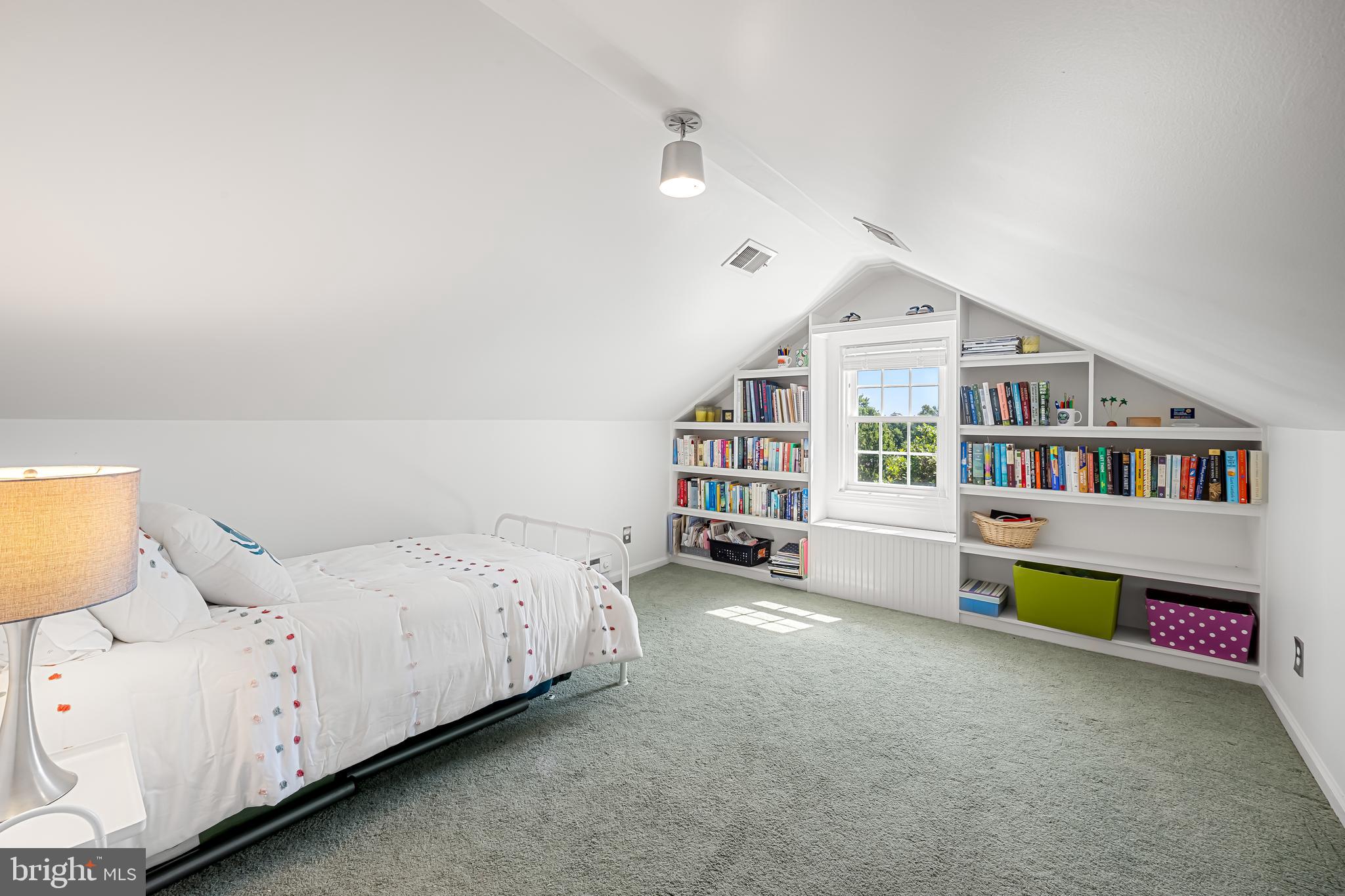 515 Yarmouth Road Baltimore, MD 21286 - Photo 27 of 44 a spacious bedroom with a bed and a book shelf