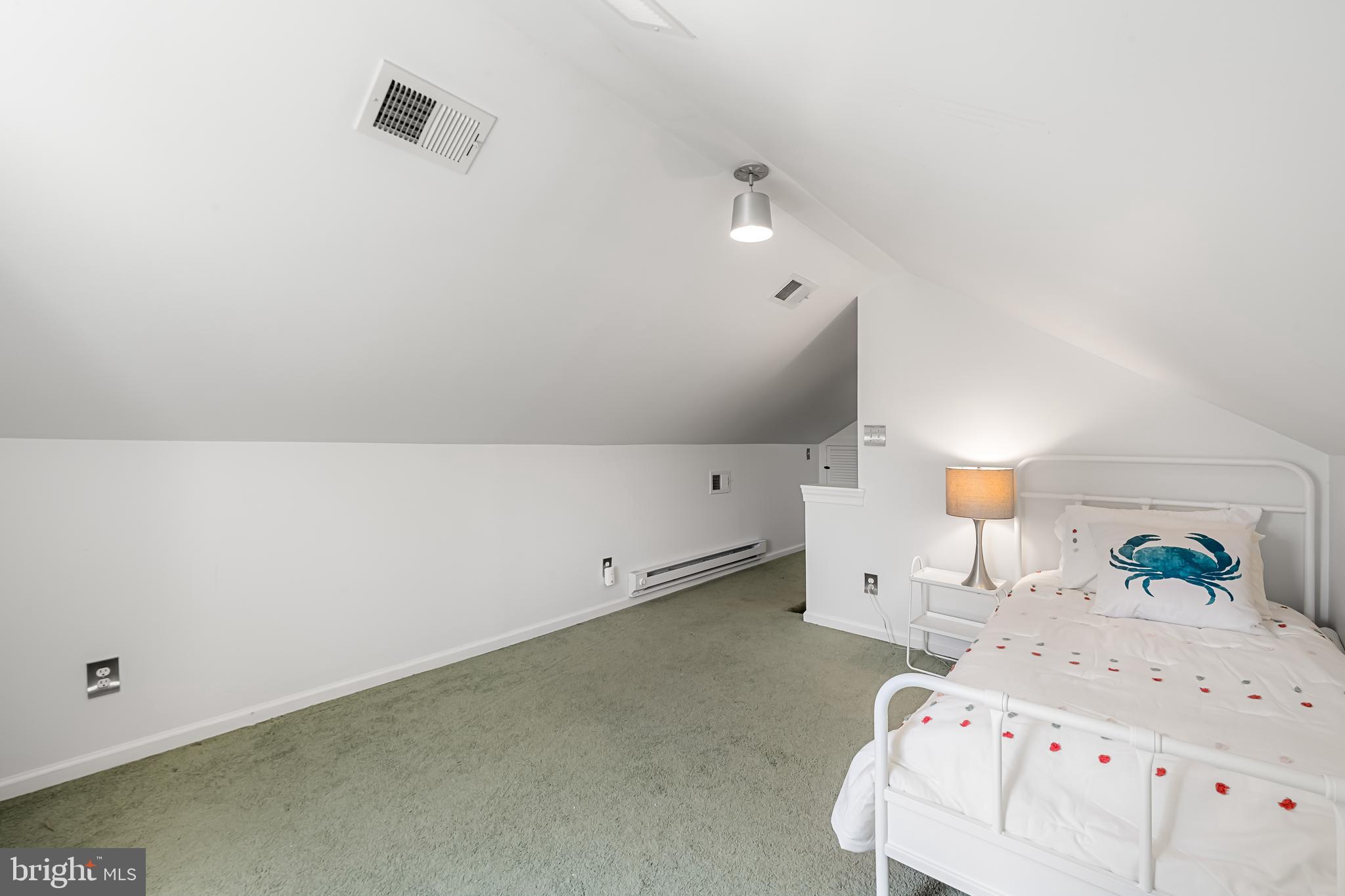 515 Yarmouth Road Baltimore, MD 21286 - Photo 28 of 44 a bedroom with a bed and a night stand