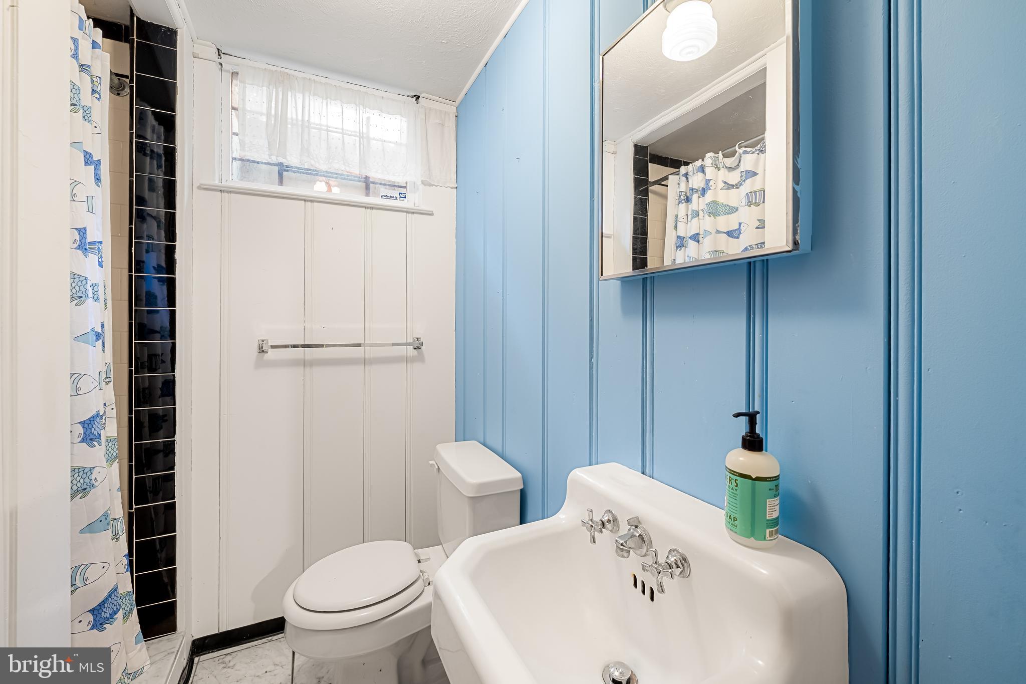 515 Yarmouth Road Baltimore, MD 21286 - Photo 31 of 44 a bathroom with a sink a toilet and shower