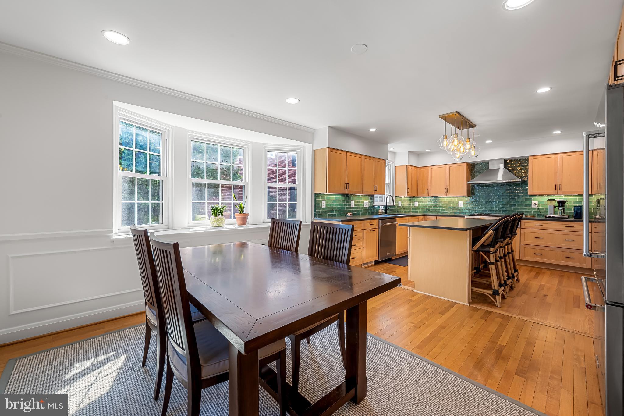 515 Yarmouth Road Baltimore, MD 21286 - Photo 6 of 44 a kitchen with stainless steel appliances granite countertop table chairs and a view of kitchen