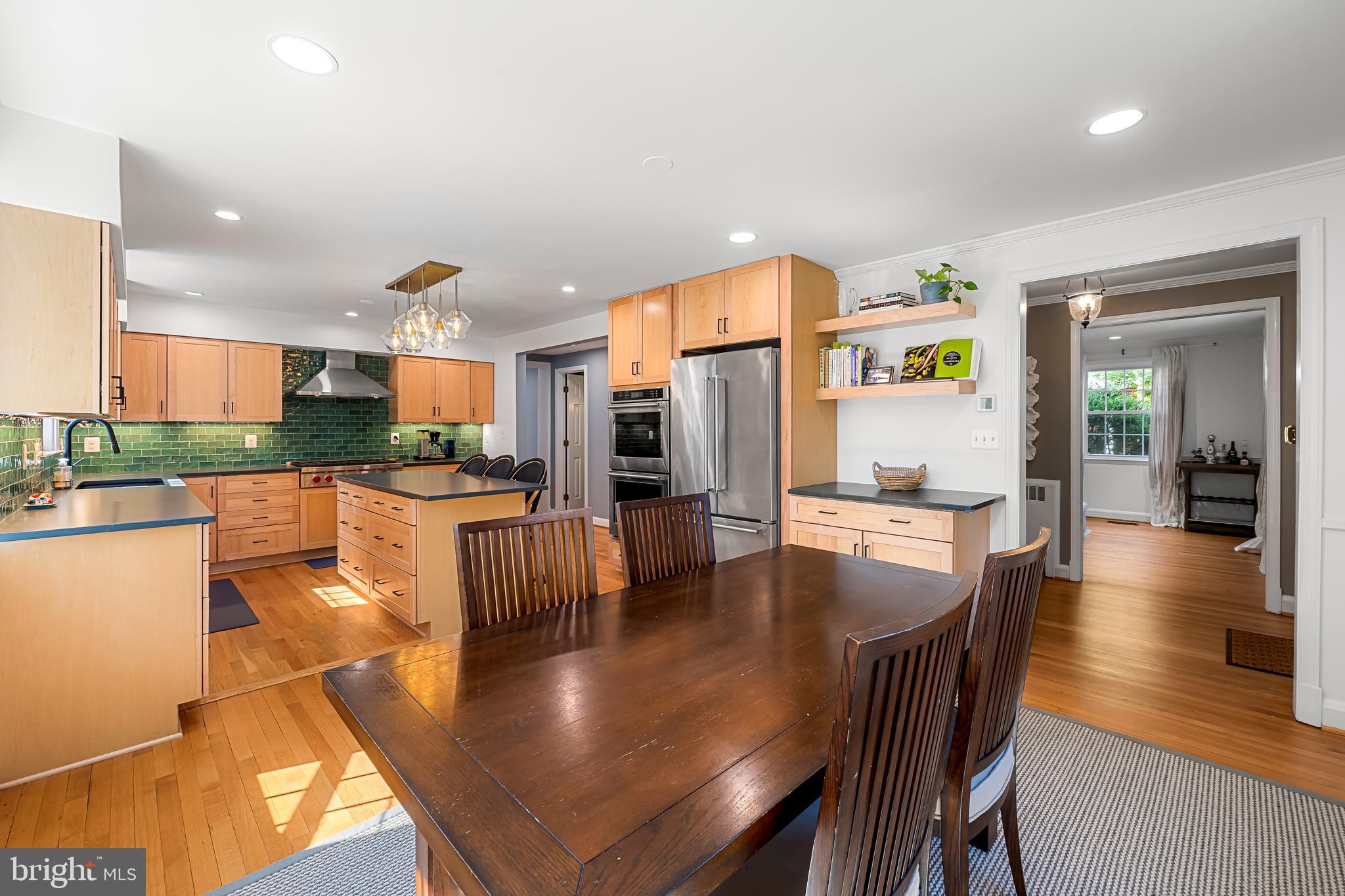 515 Yarmouth Road Baltimore, MD 21286 - Photo 7 of 44 a living room with stainless steel appliances a dining table chairs and view of kitchen