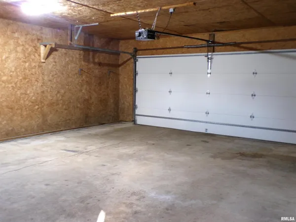 a view of empty room with stairs