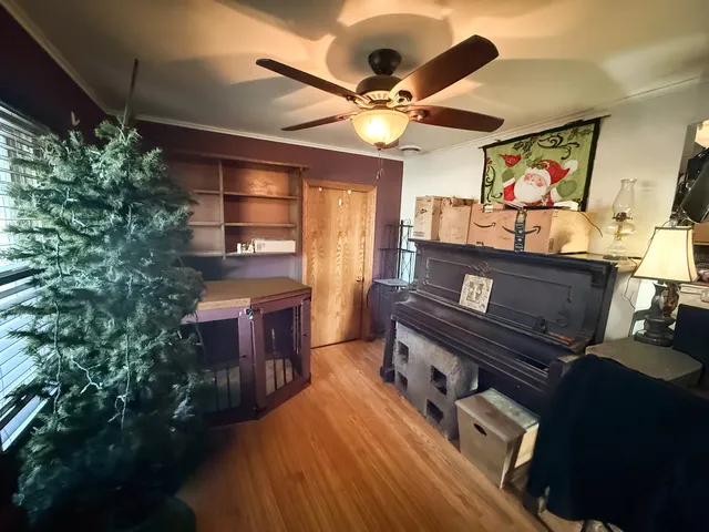 a living room with furniture a window and a flat screen tv