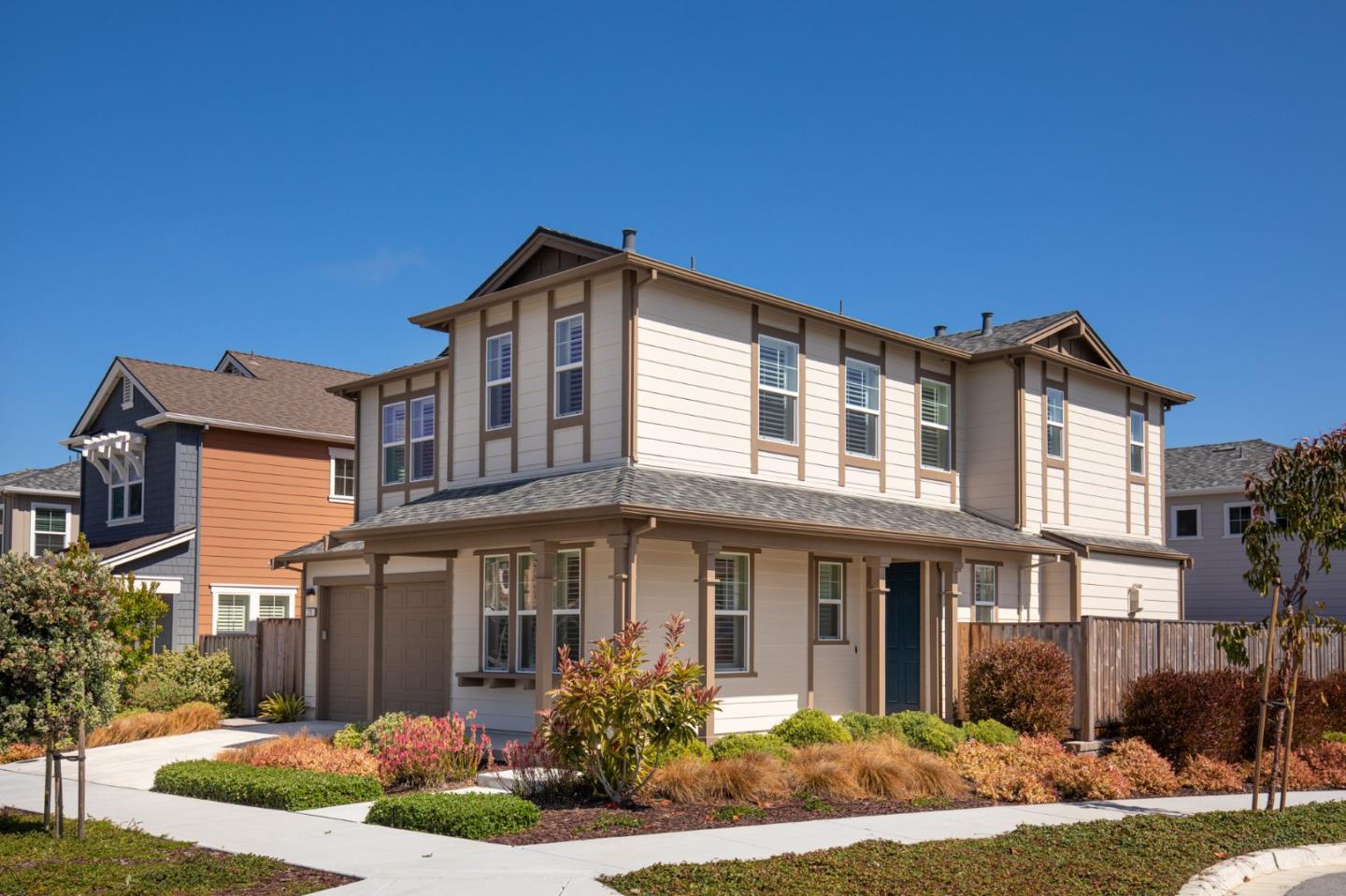 275 10th Street Marina, CA 93933 - Photo 1 of 25 a front view of a house with a yard