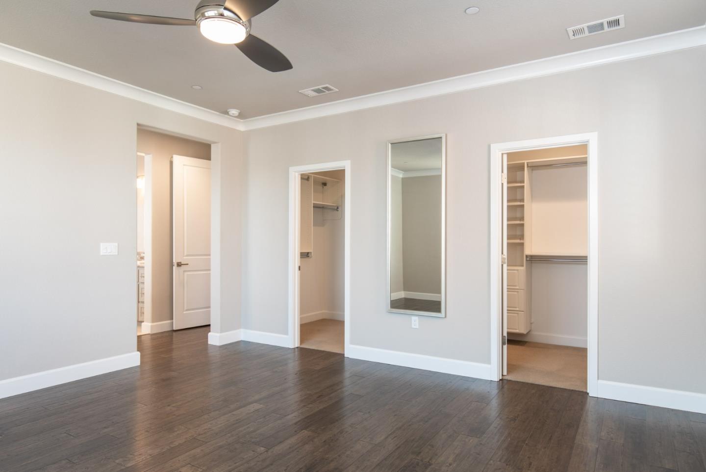 275 10th Street Marina, CA 93933 - Photo 13 of 25 an empty room with wooden floor and windows