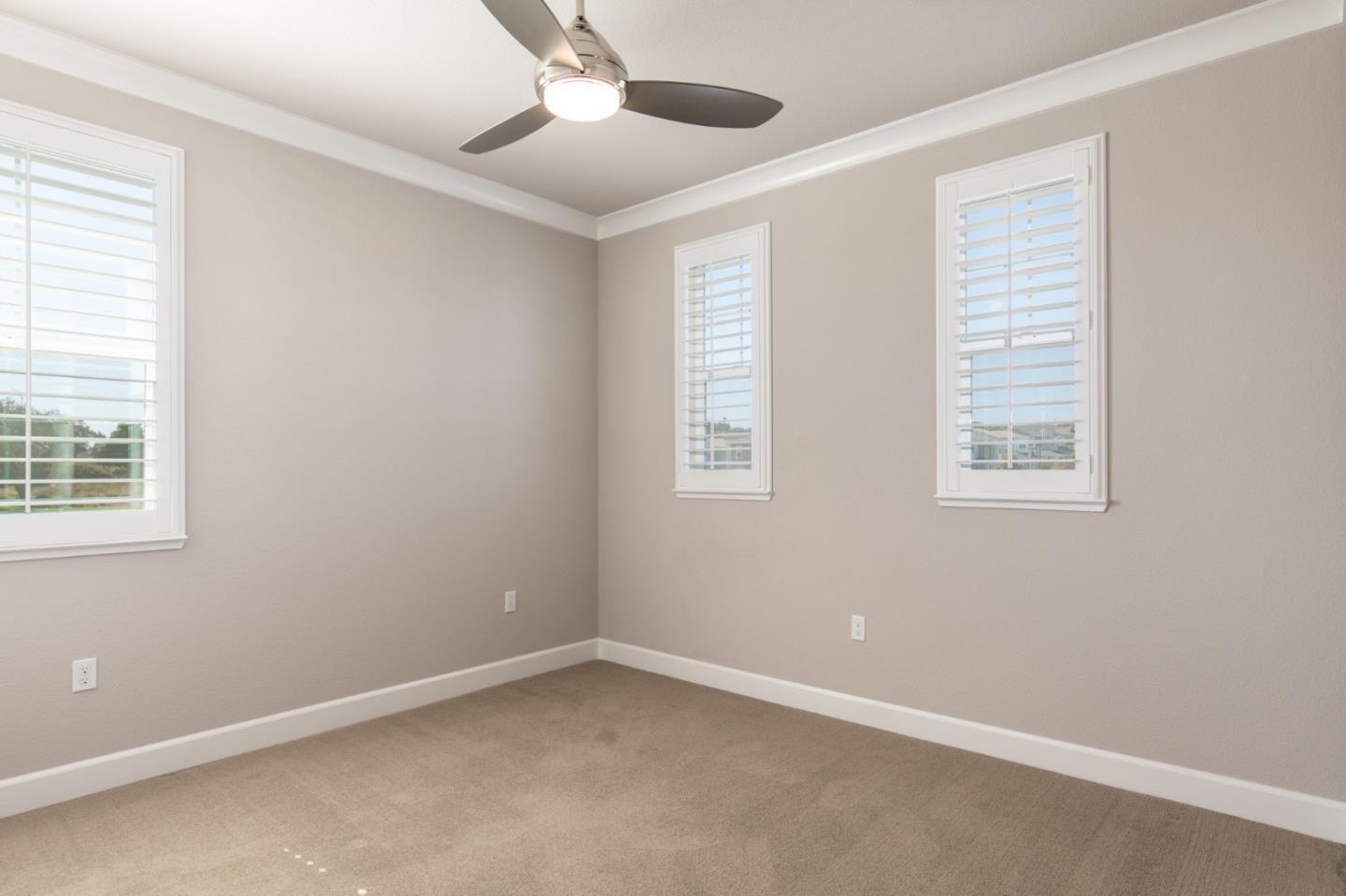 275 10th Street Marina, CA 93933 - Photo 18 of 25 an empty room with windows and fan