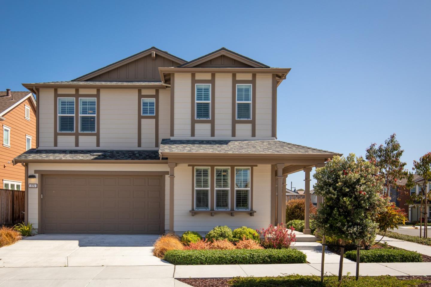 275 10th Street Marina, CA 93933 - Photo 3 of 25 a front view of a house with a garden