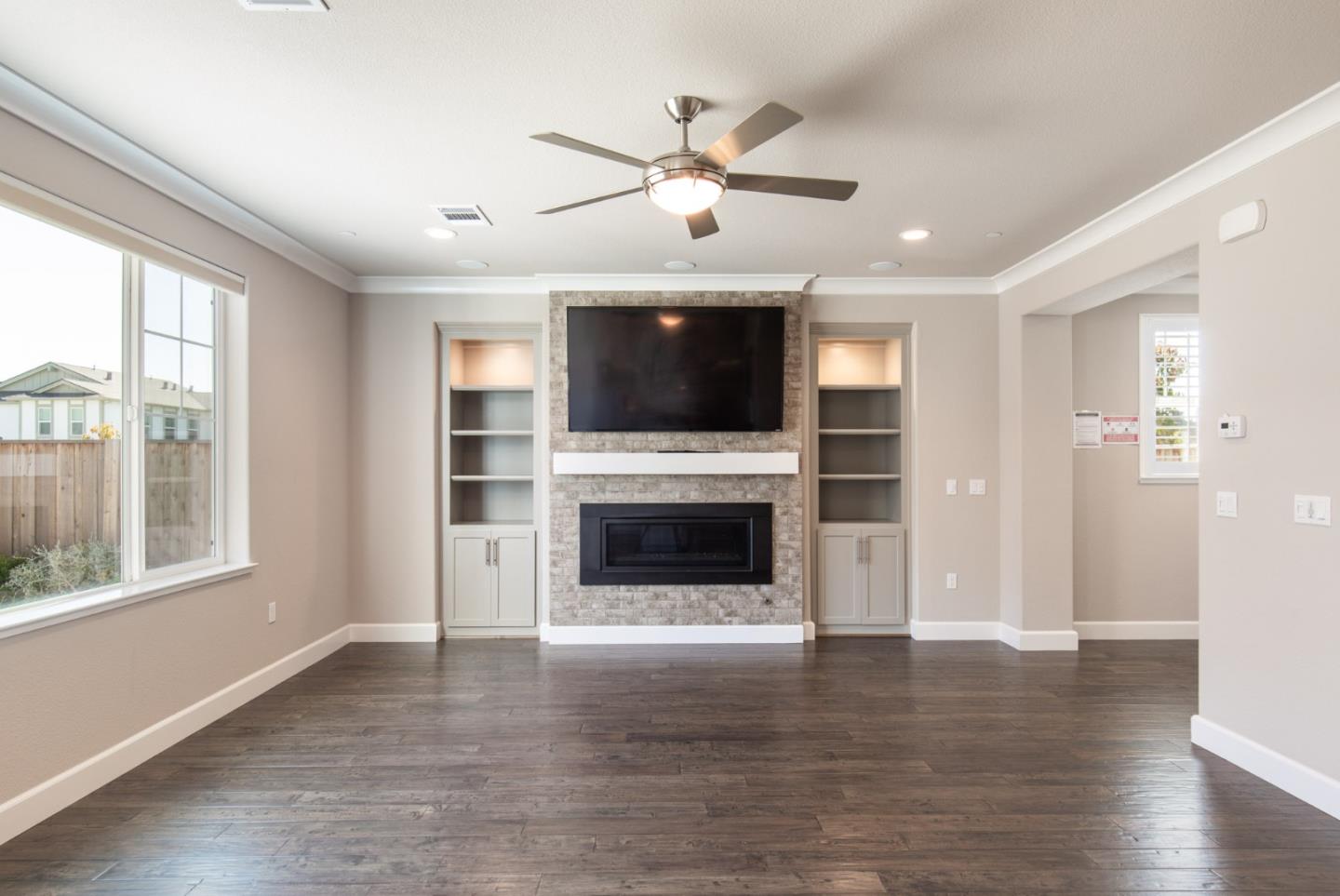 275 10th Street Marina, CA 93933 - Photo 7 of 25 a view of a livingroom with a fireplace wooden floor and windows
