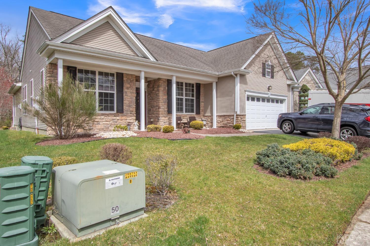 22 Park Ridge Way Jackson, NJ 08527 - Photo 2 of 38 a front view of a house with garden
