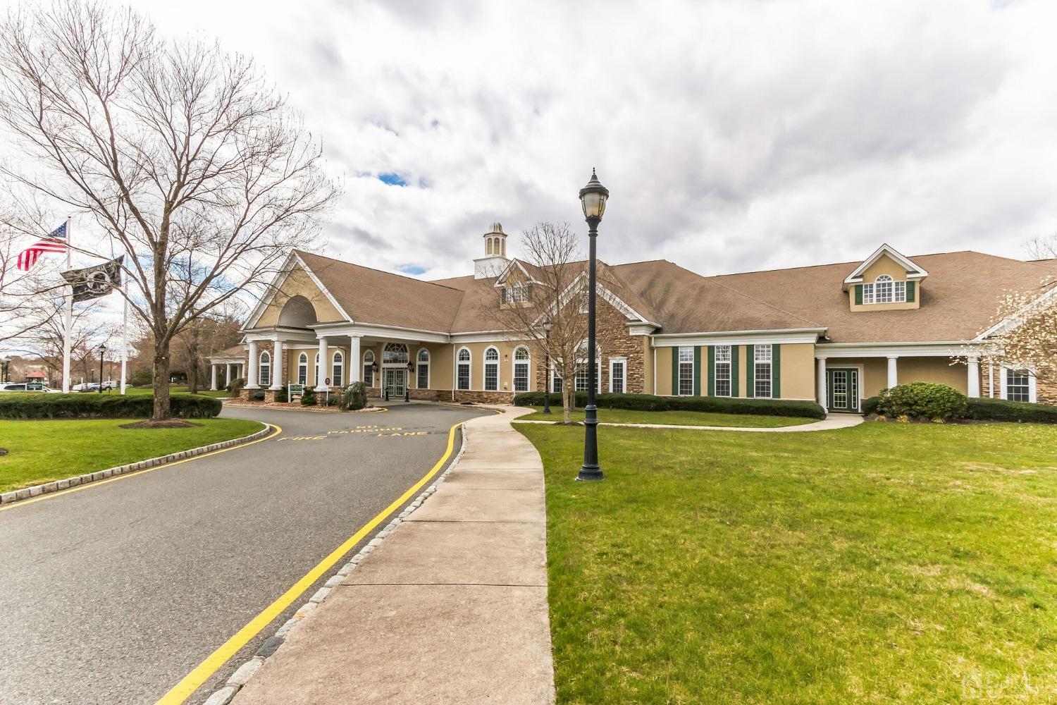 22 Park Ridge Way Jackson, NJ 08527 - Photo 29 of 38 a front view of a house with a yard and trees