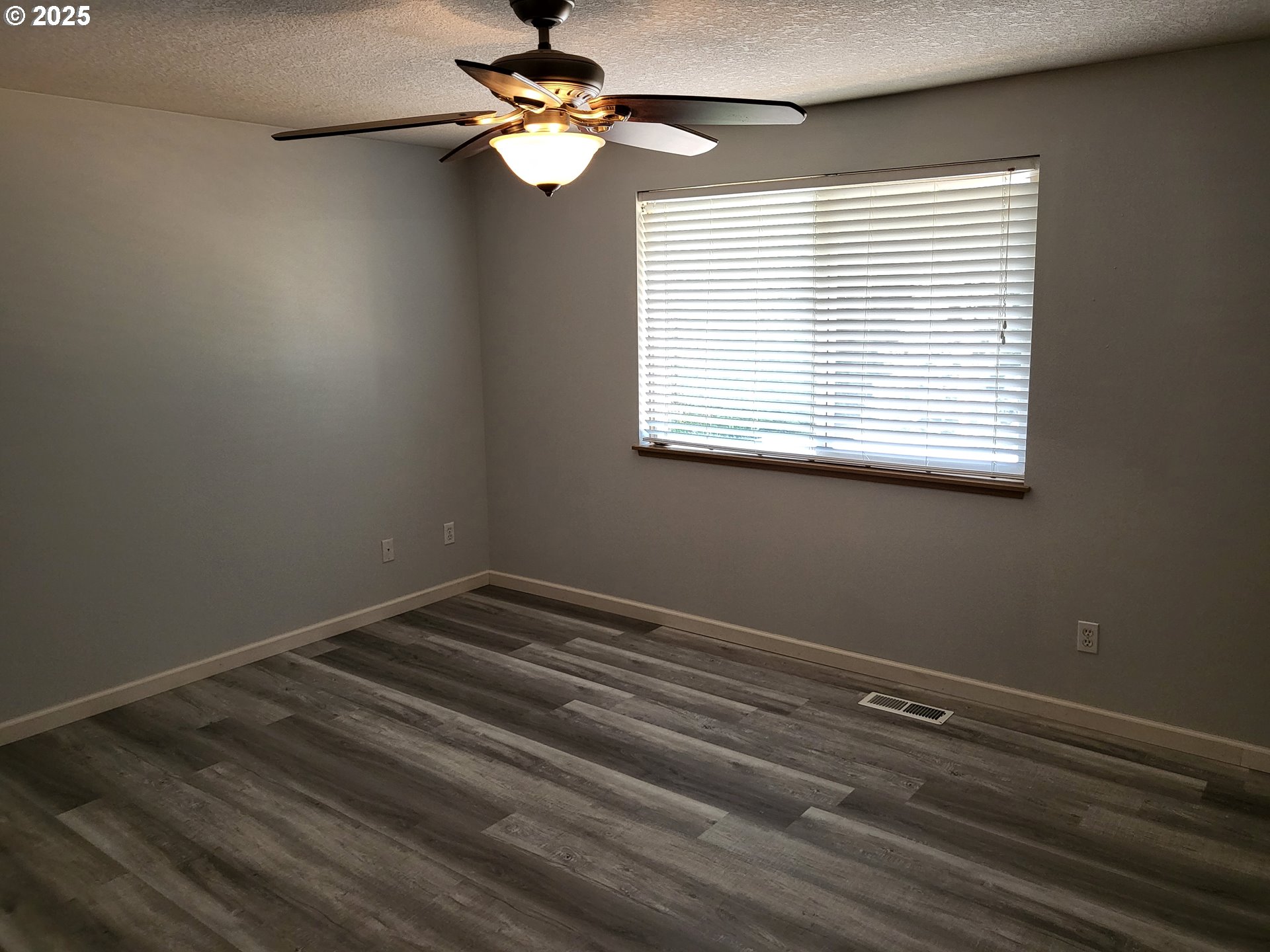 32141 Southeast Mally Road Gresham, OR 97080 - Photo 11 of 36 an empty room with a window and a fan