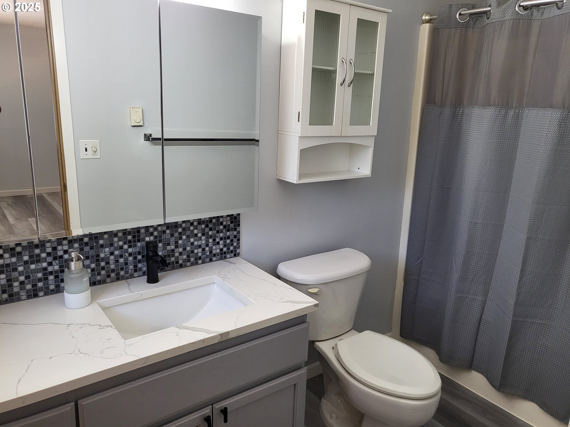 32141 Southeast Mally Road Gresham, OR 97080 - Photo 16 of 36 a bathroom with a toilet a sink and a shower