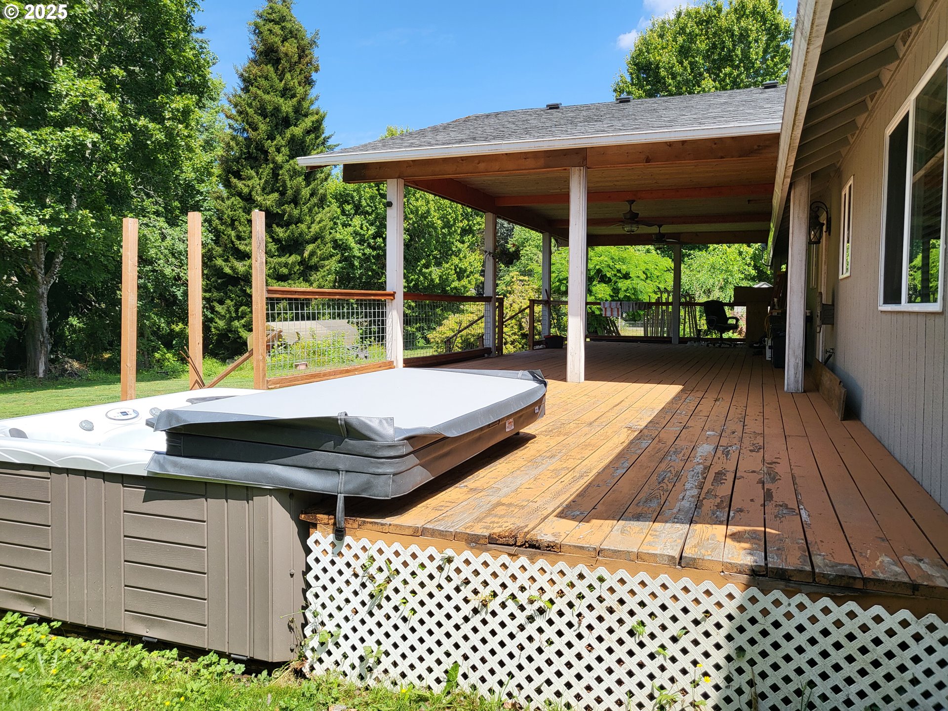 32141 Southeast Mally Road Gresham, OR 97080 - Photo 20 of 36 a view of a patio with table and chairs potted plants and large tree