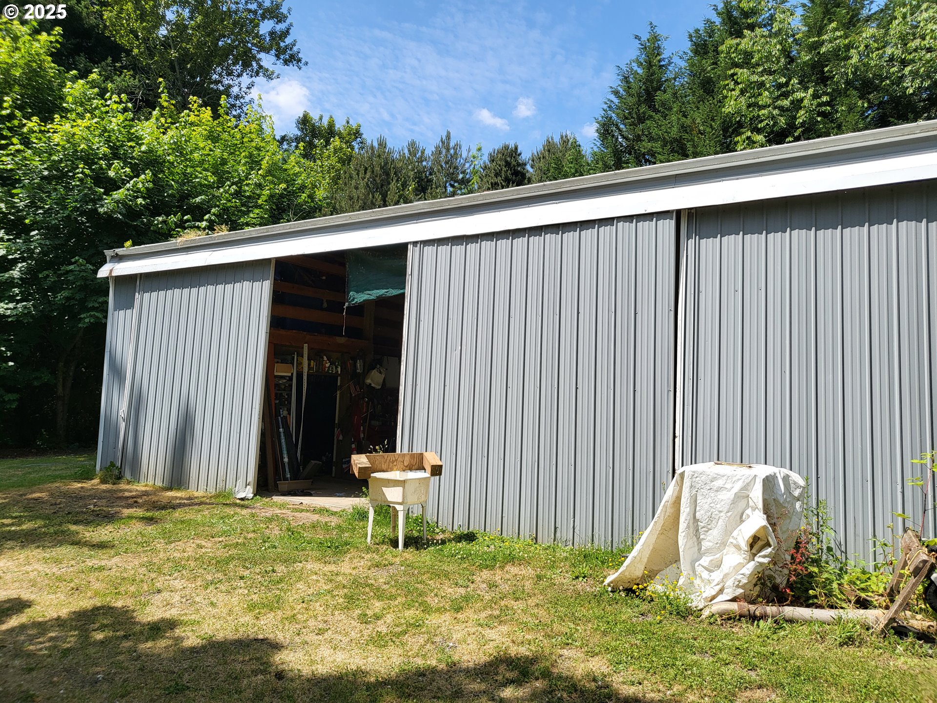 32141 Southeast Mally Road Gresham, OR 97080 - Photo 27 of 36 a backyard of a house with table and chairs