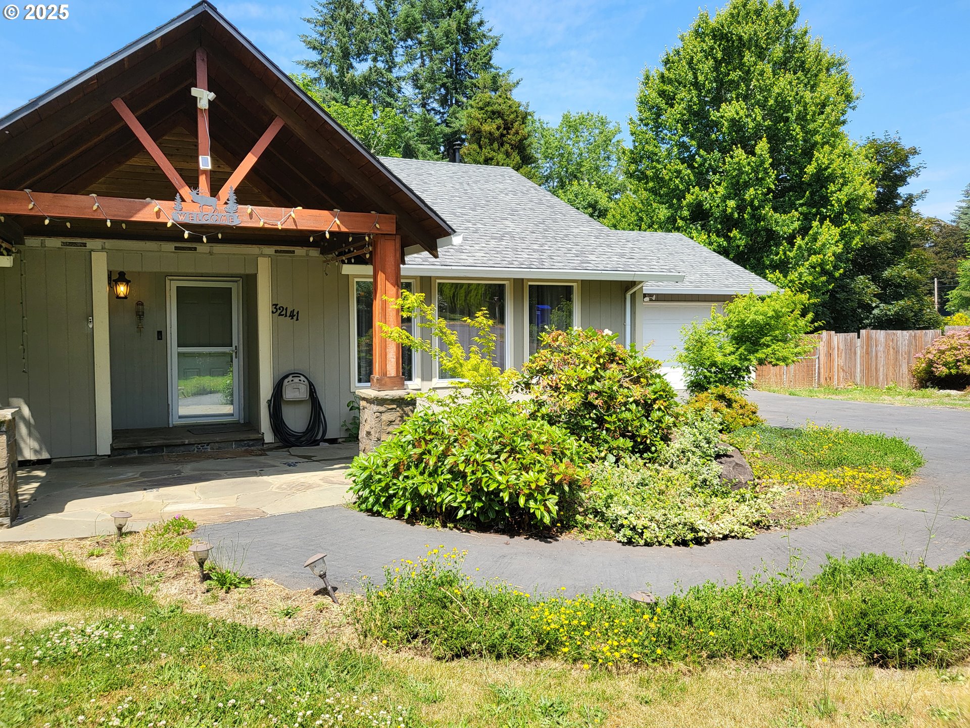 32141 Southeast Mally Road Gresham, OR 97080 - Photo 32 of 36 a front view of a house with garden