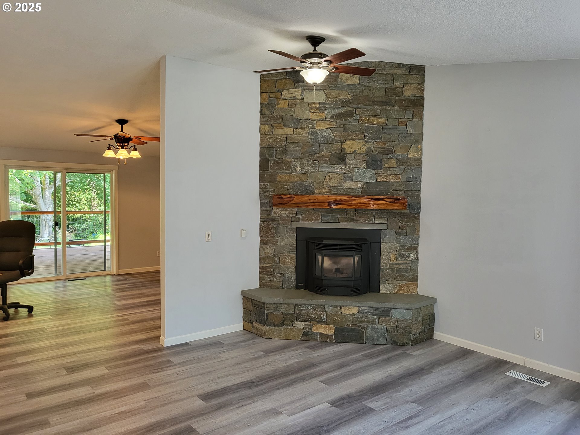 32141 Southeast Mally Road Gresham, OR 97080 - Photo 5 of 36 a living room with furniture and a fireplace