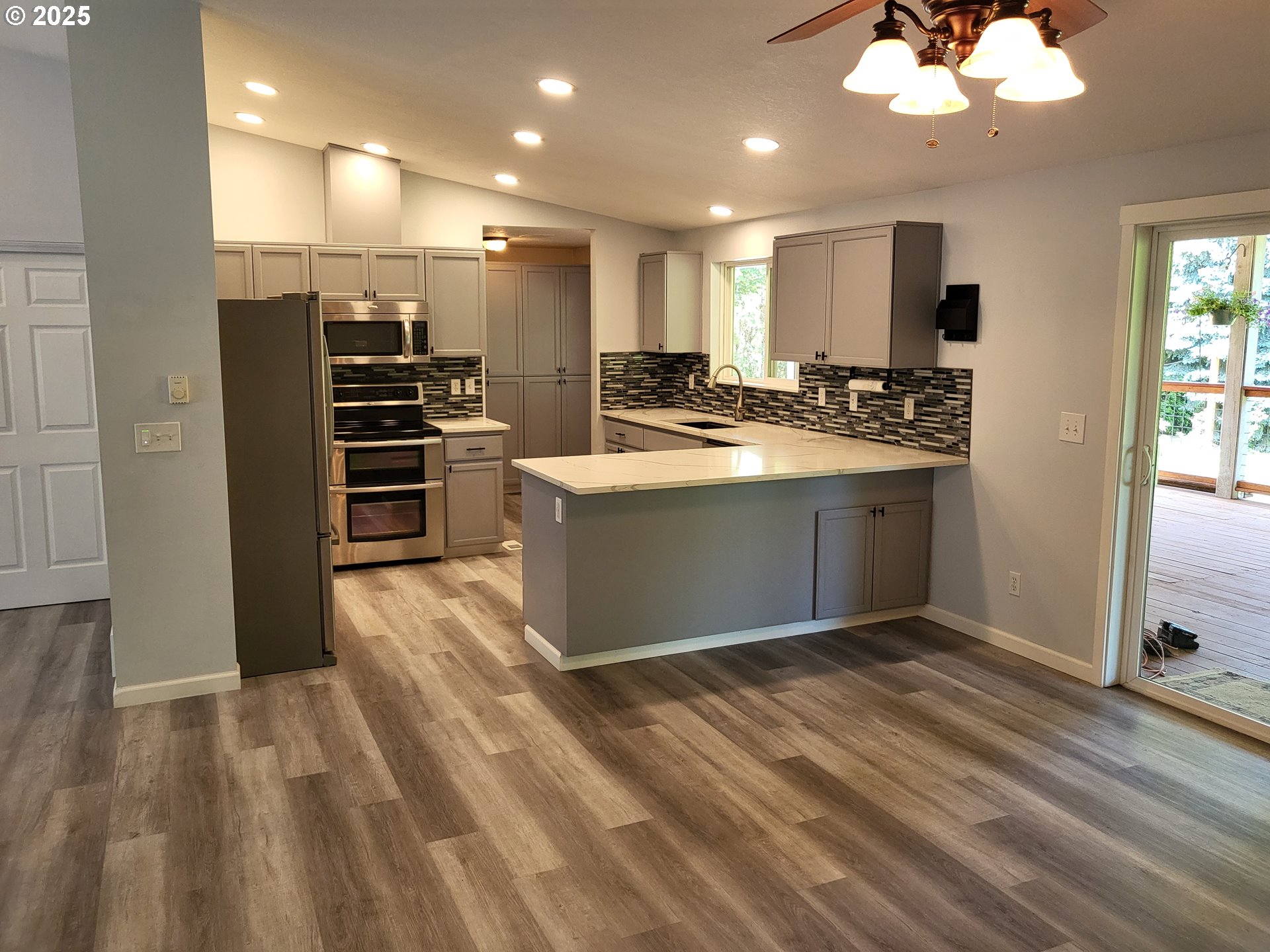 32141 Southeast Mally Road Gresham, OR 97080 - Photo 8 of 36 a view of kitchen with stainless steel appliances wooden floor and stove