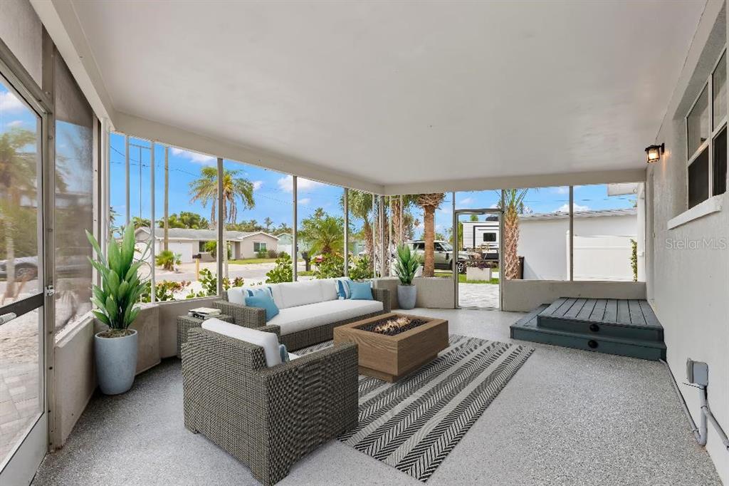 708 Sunset Cove Madeira Beach, FL 33708 - Photo 37 of 61 a living room with furniture and a large window
