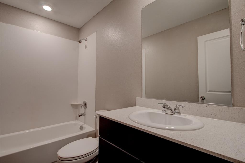 5817 Grindstone Drive Forney, TX 75126 - Photo 18 of 18 a bathroom with a sink toilet tub and shower