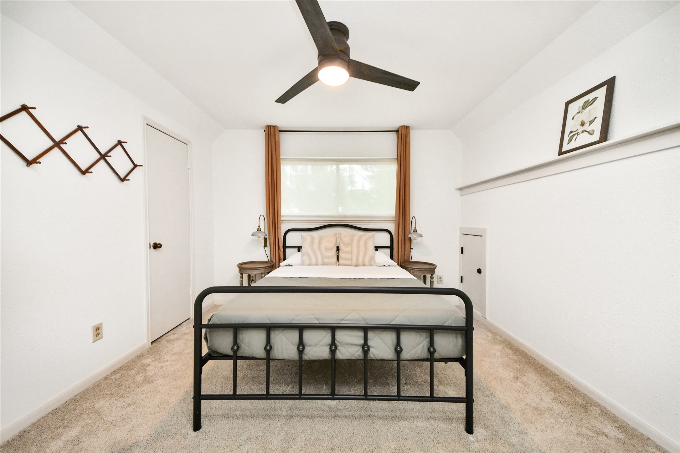 3030 Bernadette Lane Houston, TX 77043 - Photo 18 of 31 a bedroom with a bed and a chandelier