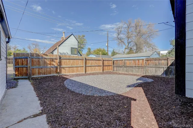 a view of backyard with a patio